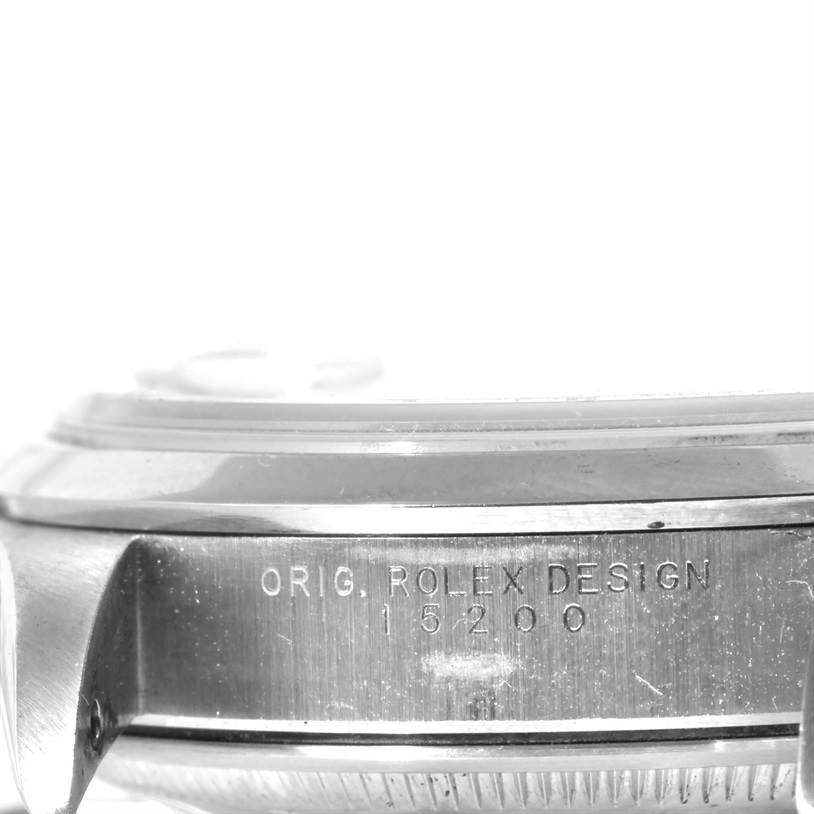 This close-up image shows the side view of the case of a Rolex Date 15200 Men's Stainless Steel Silver Dial 15200 Men's Stainless Steel Silver Dial model watch, displaying "ORIG. ROLEX DESIGN 15200" engraving.