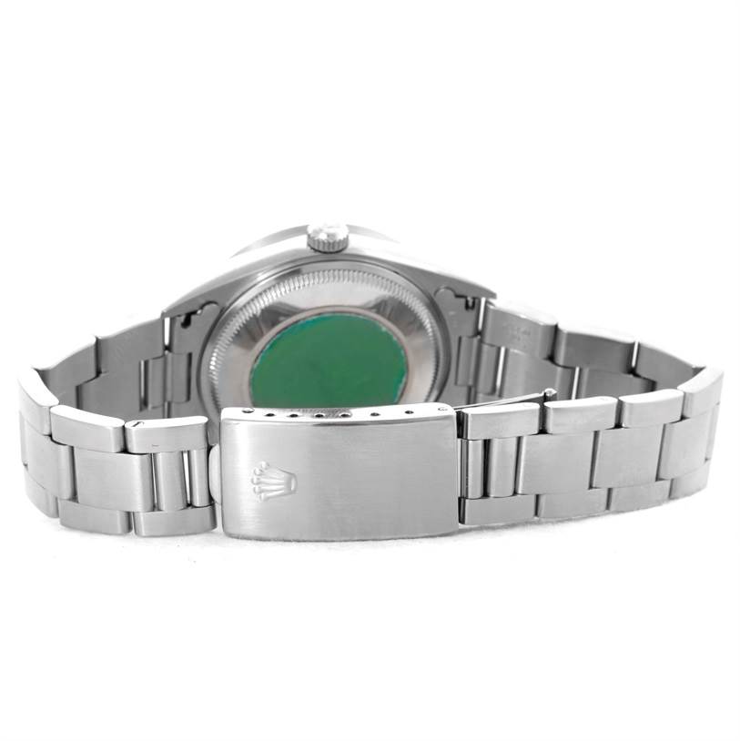 The image shows the back view of a Rolex Date 15210 Men's Stainless Steel White Dial 15210 Men's Stainless Steel White Dial model, focusing on its case, clasp, and bracelet.