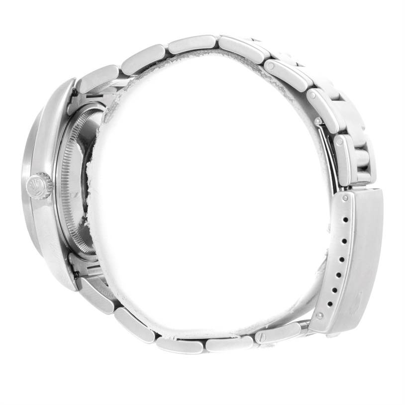 The image shows a side view of the Rolex Date 15210 Men's Stainless Steel White Dial 15210 Men's Stainless Steel White Dial model watch, highlighting its bracelet, clasp, crown, and case.