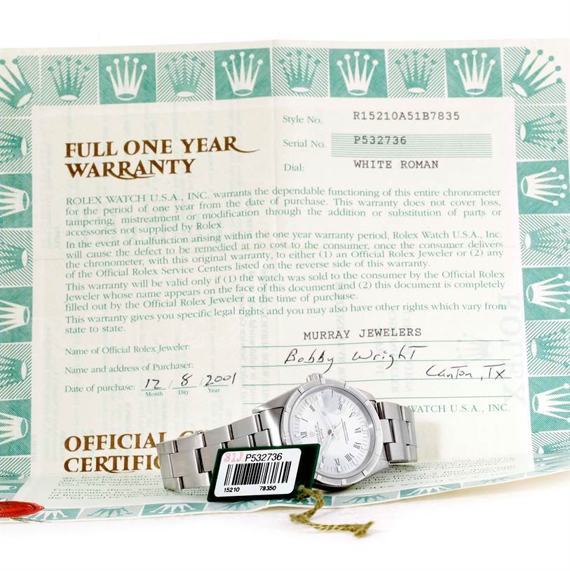 The image shows a Rolex Date 15210 Men's Stainless Steel White Dial 15210 Men's Stainless Steel White Dial watch laying flat along with its warranty certificate.