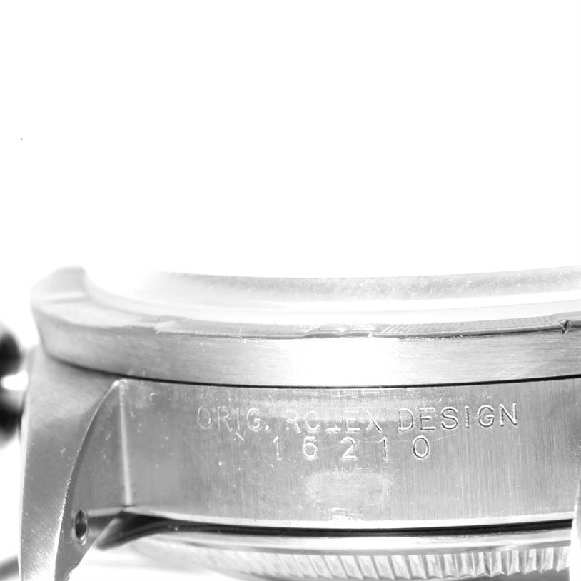 This close-up image shows the side of a Rolex Date 15210 Men's Stainless Steel White Dial 15210 Men's Stainless Steel White Dial model watch, highlighting the casing and engraved model information.