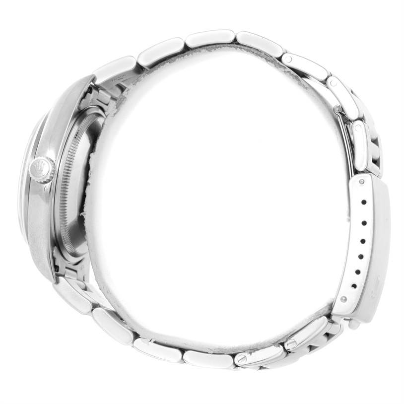 The image shows a side view of a Rolex Date 15200 Men's Stainless Steel Black Dial 15200 Men's Stainless Steel Black Dial model watch, highlighting its case, crown, and metal bracelet.