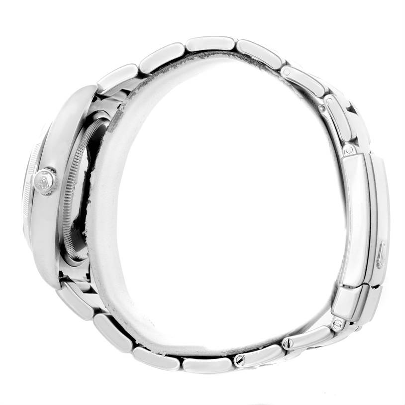 This side view of the Rolex Date 115200 Men's Stainless Steel Black Dial 115200 Men's Stainless Steel Black Dial model showcases the watch case, crown, and bracelet.