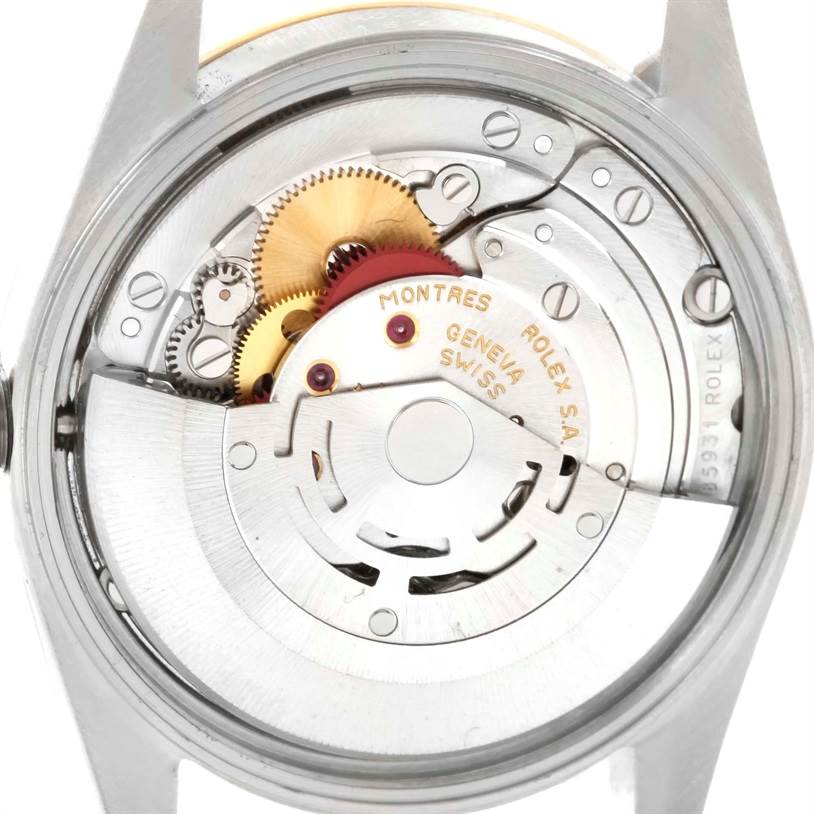 This image shows the back view of the Rolex Date 15223 Men's Steel and Gold (two tone) Champagne Dial 15223 Men's Steel and Gold (two tone) Champagne Dial model, focusing on its exposed internal movement and gears.