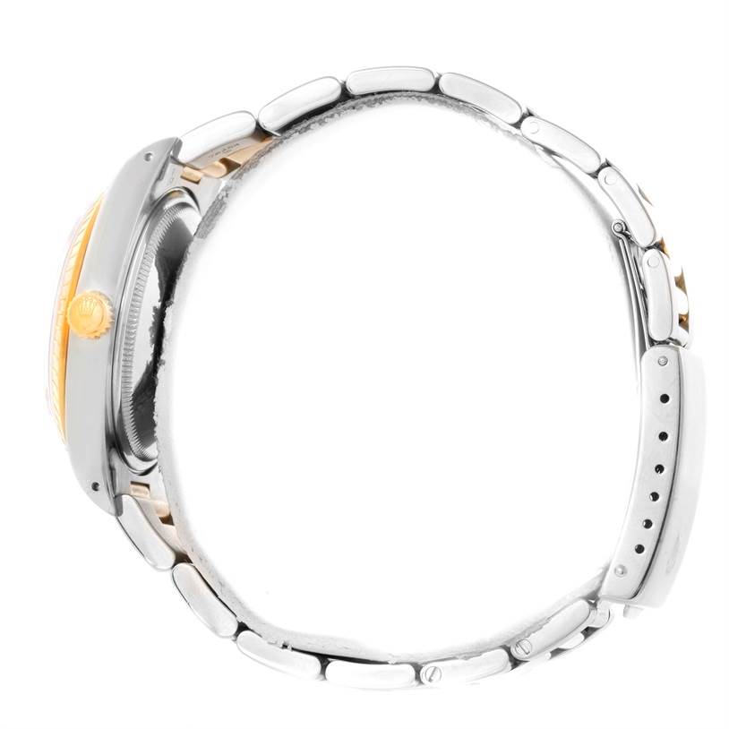 This side-angle view shows the bracelet, clasp, crown, and part of the case of the Rolex Date 15223 Men's Steel and Gold (two tone) Champagne Dial 15223 Men's Steel and Gold (two tone) Champagne Dial watch.