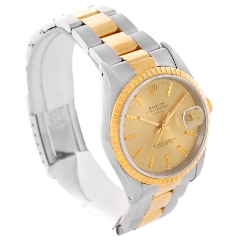 The Rolex Date 15223 Men's Steel and Gold (two tone) Champagne Dial 15223 Men's Steel and Gold (two tone) Champagne Dial watch is shown at a three-quarter angle, displaying its face, bezel, bracelet, and clasp.