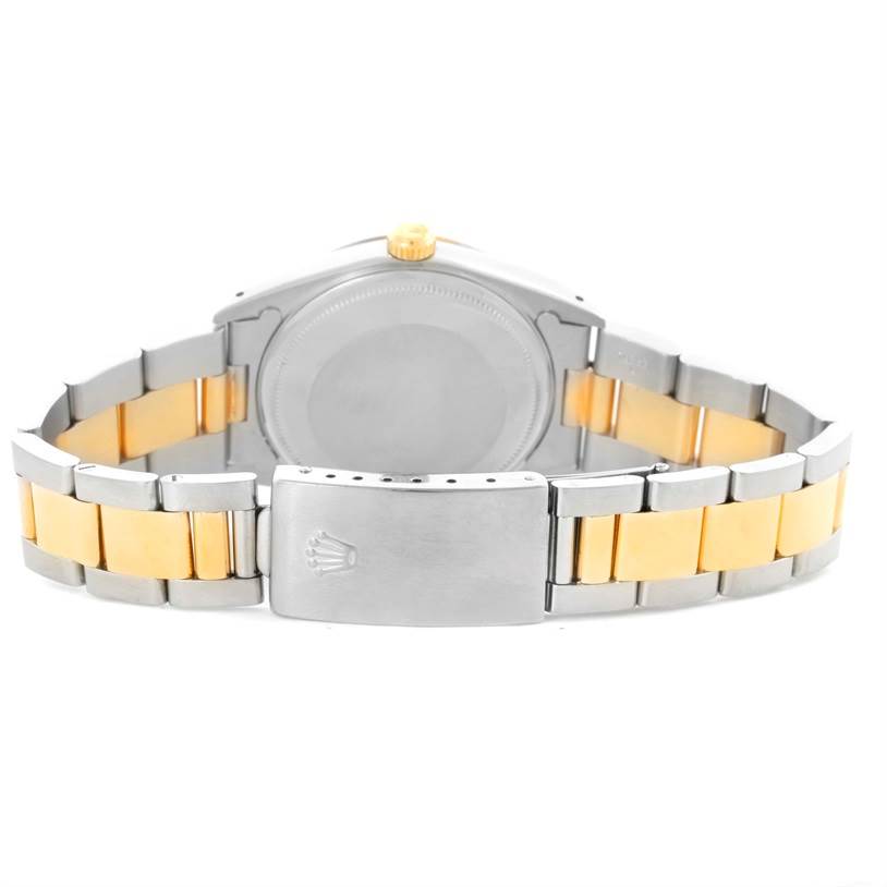 The image shows the back view of a Rolex Date 15223 Men's Steel and Gold (two tone) Champagne Dial 15223 Men's Steel and Gold (two tone) Champagne Dial model watch, highlighting the case, crown, and two-tone bracelet with a clasp.