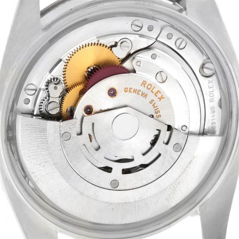 This image shows the internal mechanism of a Rolex Date 115200SRO Men's Stainless Steel White Dial 115200SRO Men's Stainless Steel White Dial model watch, focusing on its gears and movement components.