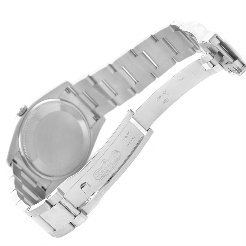 The image shows the opened clasp and case back of a Rolex Date 115200SRO Men's Stainless Steel White Dial 115200SRO Men's Stainless Steel White Dial model watch from a rear angle.