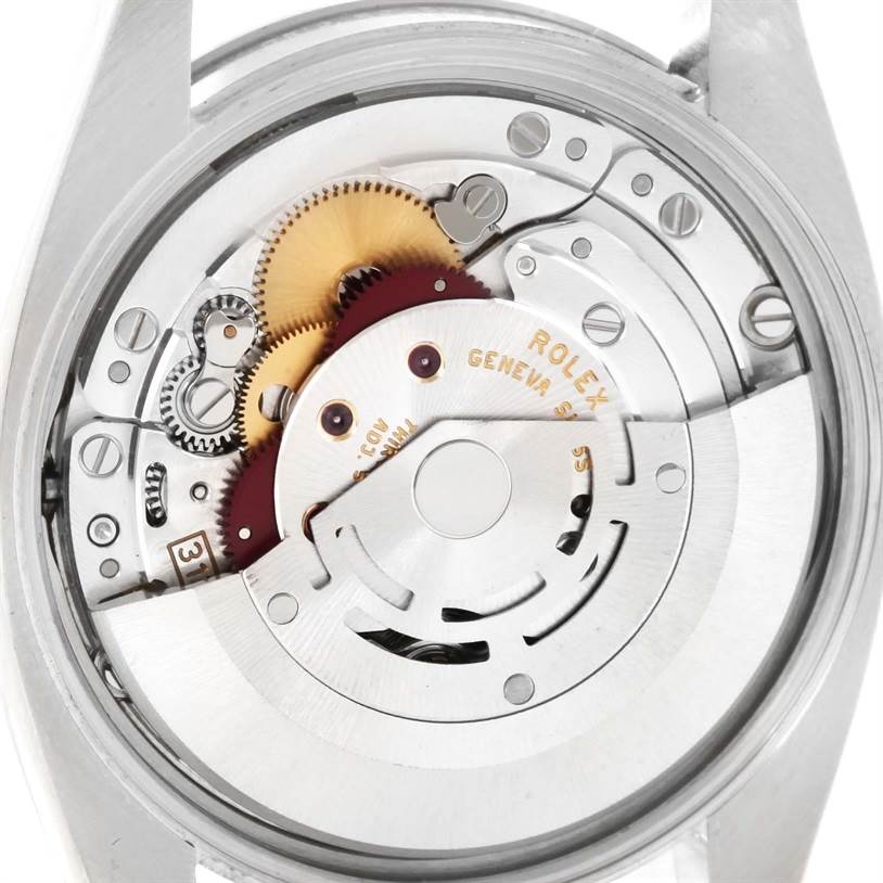 This image shows the internal mechanism of a Rolex Date 115234WRO Men's Stainless Steel White Dial 115234WRO Men's Stainless Steel White Dial model watch from a rear angle.