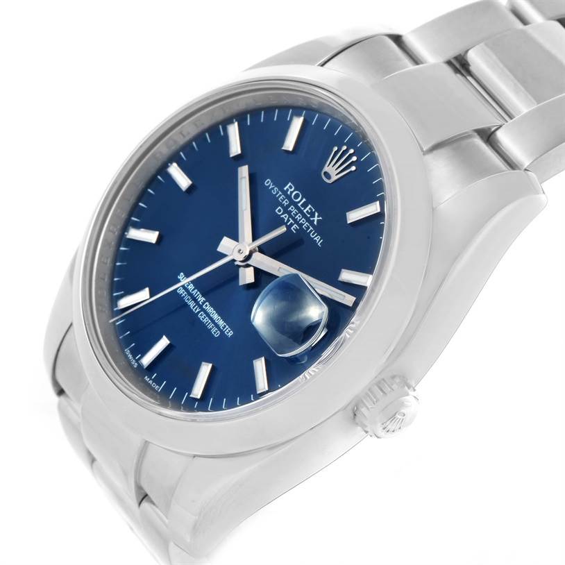 The image shows a Rolex Date 115200 Men's Stainless Steel Blue Dial 115200 Men's Stainless Steel Blue Dial model watch at an angle highlighting the dial, bezel, crown, and part of the bracelet.