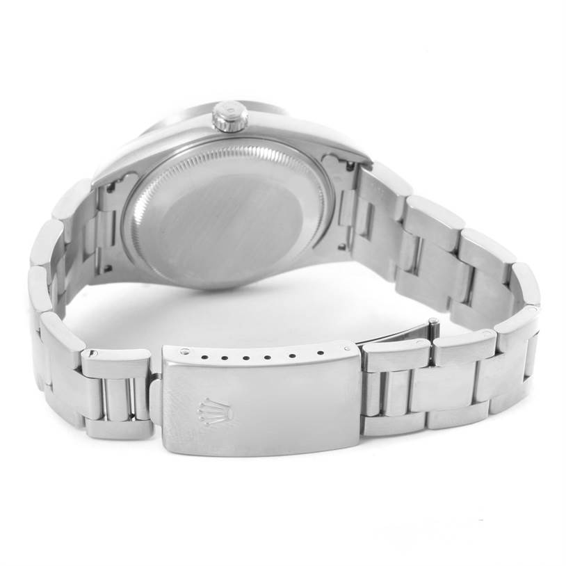 The image shows the back and clasp of a Rolex Date 15210 Men's Stainless Steel Black Dial 15210 Men's Stainless Steel Black Dial model watch, highlighting the case back and bracelet.