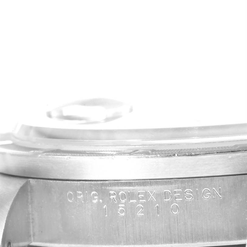 This image shows a close-up angle of the case side of a Rolex Date 15210 Men's Stainless Steel Black Dial 15210 Men's Stainless Steel Black Dial model with the design number 15210 engraved.