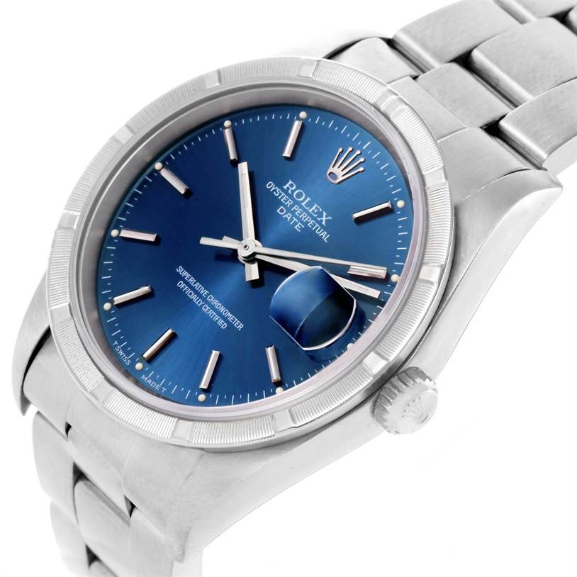 The image shows a close-up angle of a Rolex Oyster Perpetual Date watch, highlighting the dial, bezel, and bracelet.