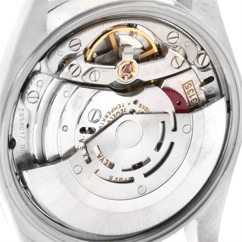 The image shows a close-up of the movement and internal components of a Rolex Date 15210 Men's Stainless Steel Blue Dial 15210 Men's Stainless Steel Blue Dial model watch.