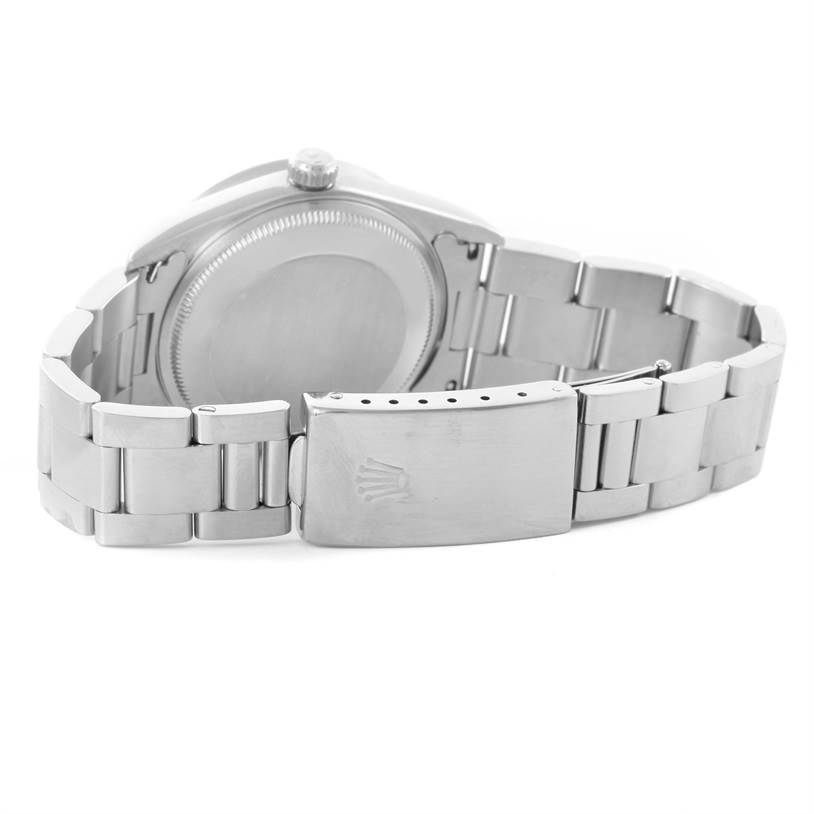 The image shows the back case and metal bracelet clasp of a Rolex Date 15210 Men's Stainless Steel Blue Dial 15210 Men's Stainless Steel Blue Dial watch.