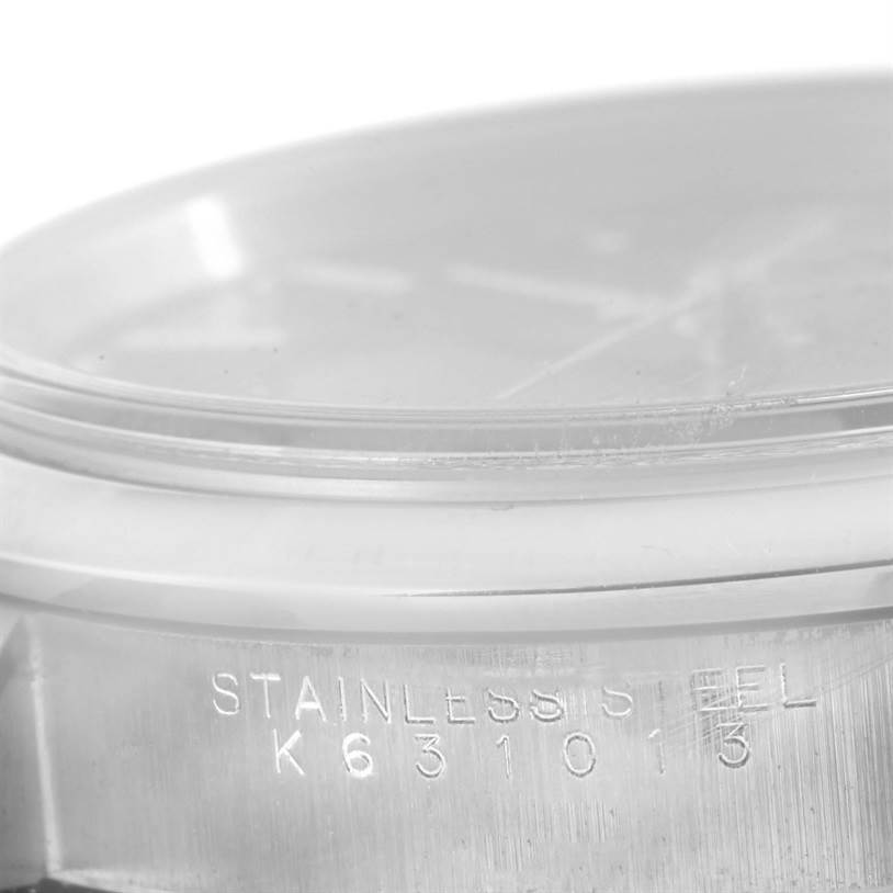 The image shows the side view of a Rolex Date 15200 Men's Stainless Steel Black Dial 15200 Men's Stainless Steel Black Dial model watch, highlighting the stainless steel casing and part of the crystal.