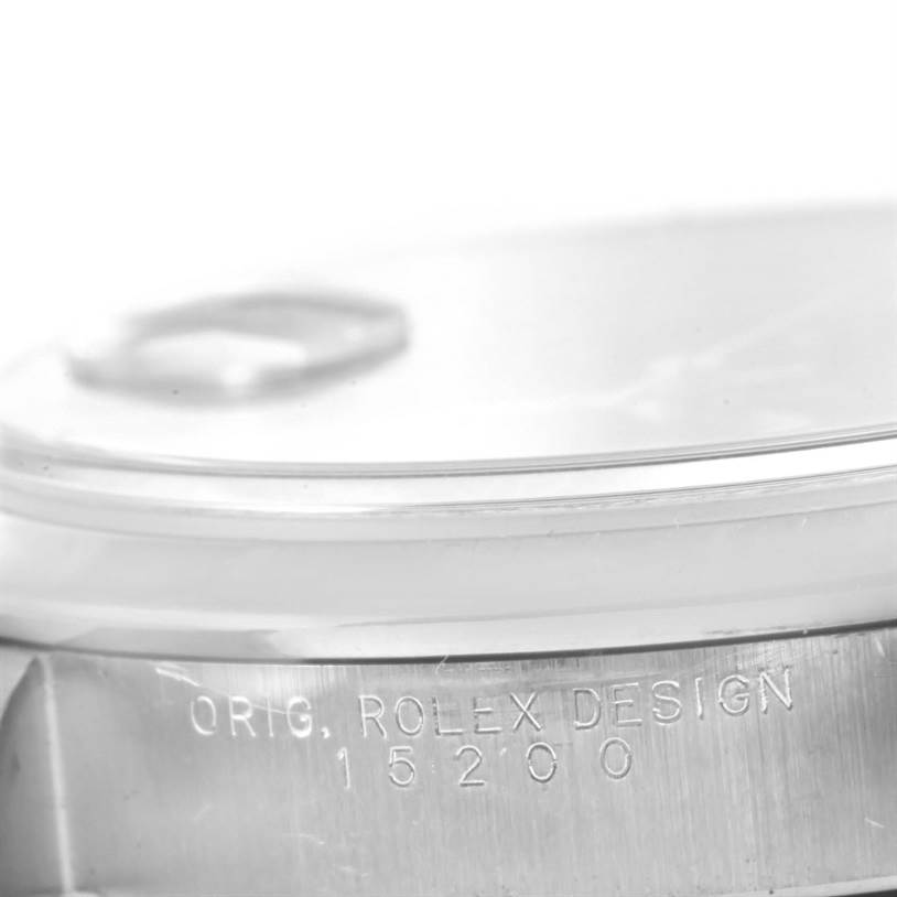 The image shows a close-up side view of the Date model by Rolex, highlighting the engraved case serial number '15200'.