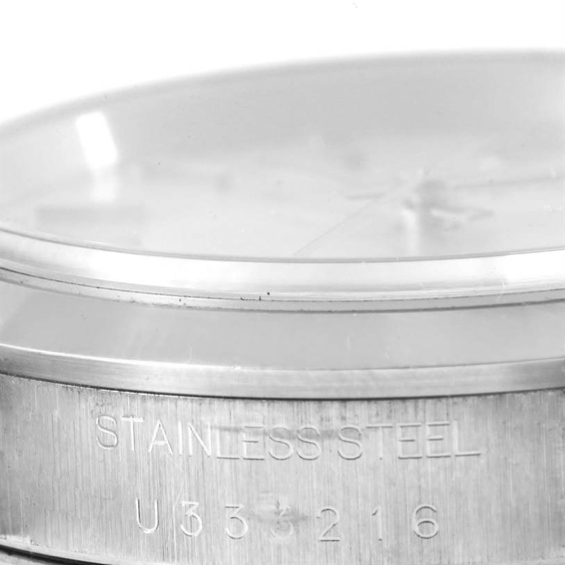 This image shows a close-up of the side and bezel of a Rolex Date 15200 Men's Stainless Steel Black Dial 15200 Men's Stainless Steel Black Dial model watch, highlighting the stainless steel marking.