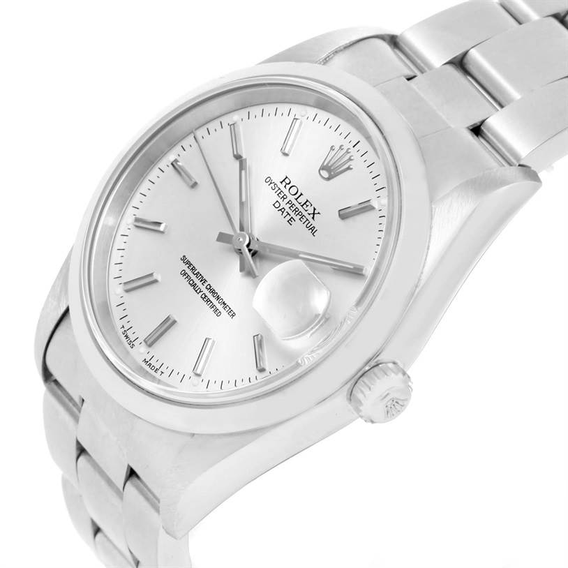 This image displays a Rolex Oyster Perpetual Date model watch from an angled view, showing its face, bezel, crown, and part of the bracelet.