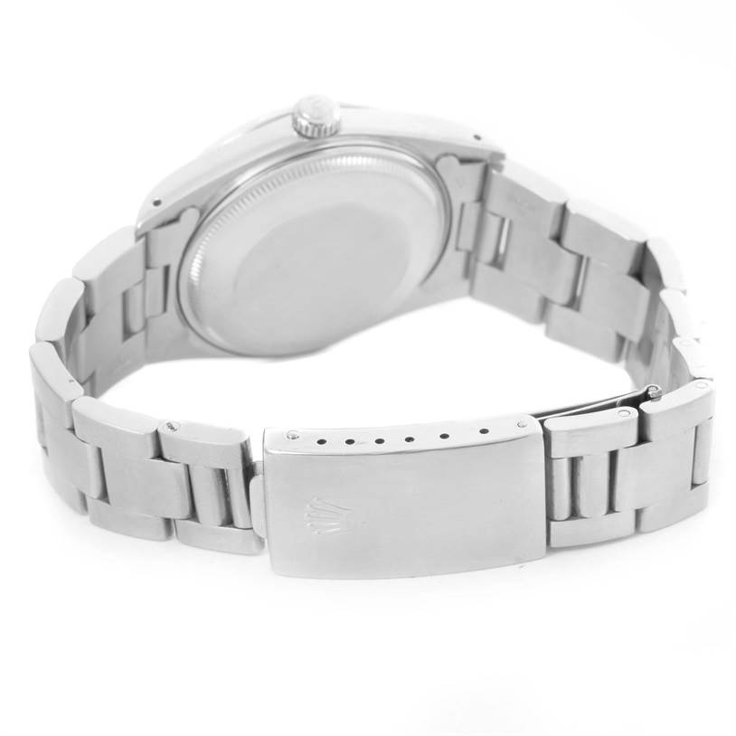 The image shows the back case and bracelet clasp of a Rolex Date 15000 Men's Stainless Steel White Dial 15000 Men's Stainless Steel White Dial model watch.