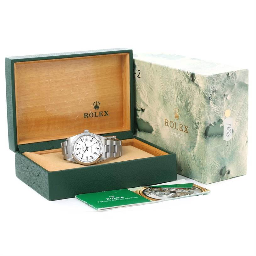 This image shows a Rolex Date 15000 Men's Stainless Steel White Dial 15000 Men's Stainless Steel White Dial model watch at a slight angle within an open box, accompanied by a manual and outer box.