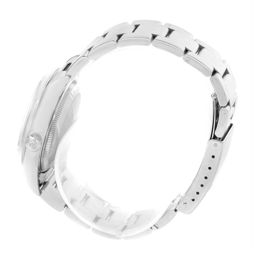 This side view of the Rolex Date 15200 Men's Stainless Steel  15200 Men's Stainless Steel  watch shows the case, crown, and part of the metal bracelet with the clasp.