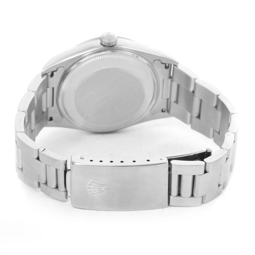 The image displays the back case and clasp of a Rolex Date 15200 Men's Stainless Steel  15200 Men's Stainless Steel  model watch from a rear bottom angle.