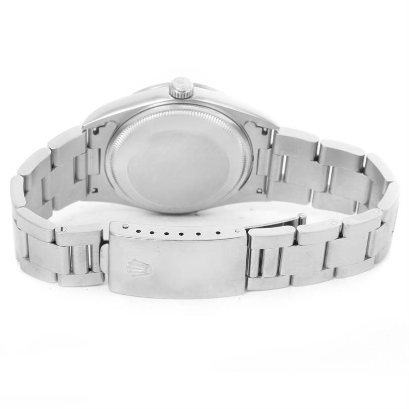 The image shows the back view of the Rolex Date 15200 Men's Stainless Steel Blue Dial 15200 Men's Stainless Steel Blue Dial model watch, emphasizing the case back and metal bracelet with the clasp.