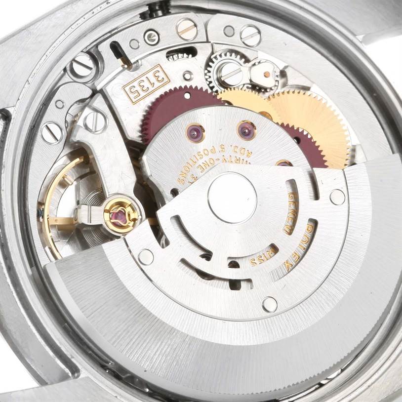 This image shows the exposed automatic movement mechanism of a Rolex Date 115200 Men's Stainless Steel Black Dial 115200 Men's Stainless Steel Black Dial model watch, viewed from the back.