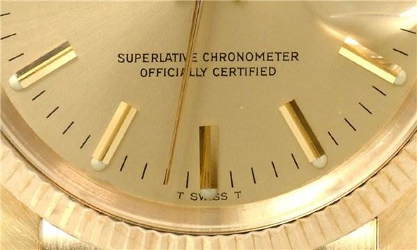 Close-up of the dial on a Rolex Date 1503 Men's Yellow Gold Champagne Dial 1503 Men's Yellow Gold Champagne Dial model, showing the gold hour markers and text "Superlative Chronometer Officially Certified."