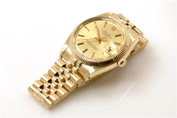The image shows a Rolex Date 1503 Men's Yellow Gold Champagne Dial 1503 Men's Yellow Gold Champagne Dial model watch angled to display the face, bezel, and part of the bracelet.