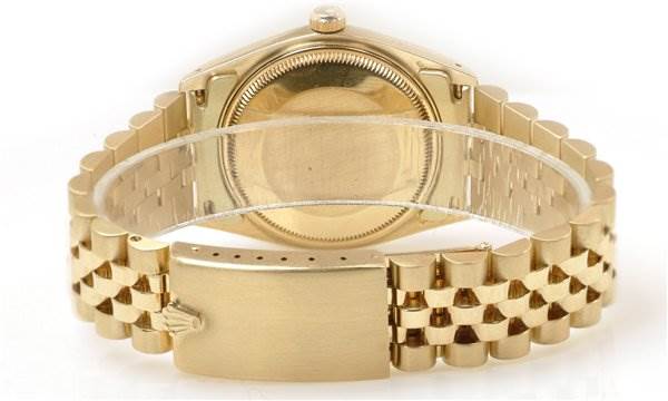 The image shows the back view of a Rolex Date 1503 Men's Yellow Gold Champagne Dial 1503 Men's Yellow Gold Champagne Dial model watch, displaying the case back and bracelet.