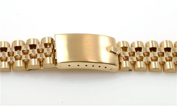 The image shows a close-up of the clasp and part of the bracelet for a Rolex Date 1503 Men's Yellow Gold Champagne Dial 1503 Men's Yellow Gold Champagne Dial model watch.