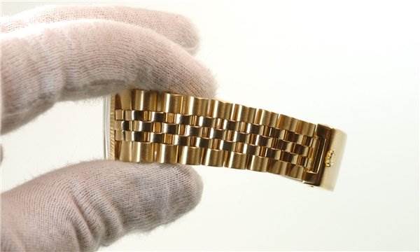 The image shows the bracelet of a Rolex Date 1503 Men's Yellow Gold Champagne Dial 1503 Men's Yellow Gold Champagne Dial model watch from a side angle, focusing on the clasp and links.