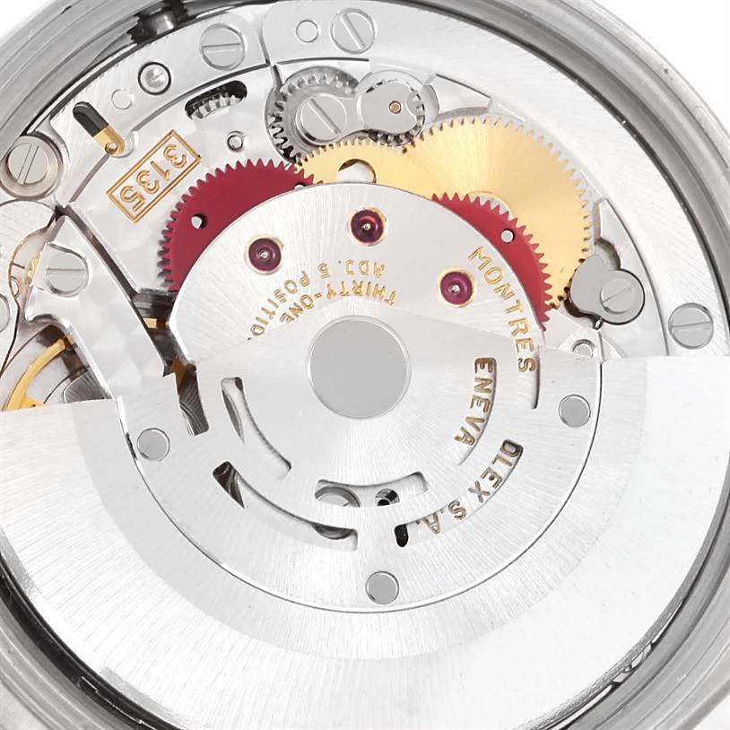 This image shows the internal mechanical movement and gears of a Rolex Date 15210 Men's Stainless Steel Blue Dial 15210 Men's Stainless Steel Blue Dial model watch from a close-up angle.