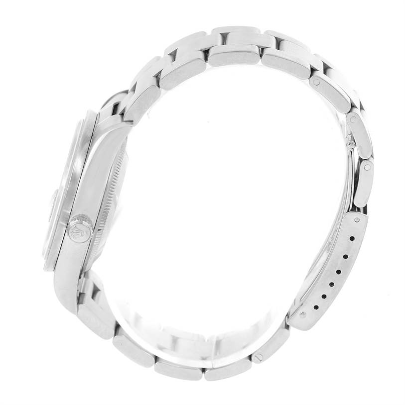 The image shows a side view of a Rolex Date 15210 Men's Stainless Steel Blue Dial 15210 Men's Stainless Steel Blue Dial model watch, highlighting its metal bracelet and case.