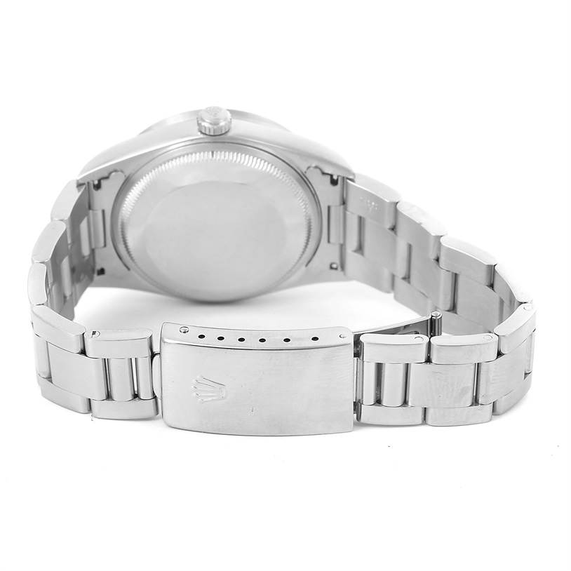 This image shows the back and clasp of a Rolex Date 15210 Men's Stainless Steel Blue Dial 15210 Men's Stainless Steel Blue Dial model watch from a slightly elevated angle.