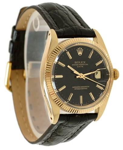 This is a side-angle view of a Rolex Date 1503 Men's Yellow Gold Black Dial 1503 Men's Yellow Gold Black Dial model watch, displaying its black dial, gold casing, and black leather strap.