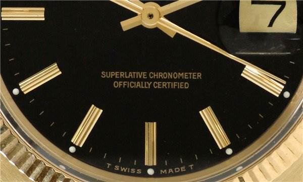 This image shows a close-up view of a Rolex Date 1503 Men's Yellow Gold Black Dial 1503 Men's Yellow Gold Black Dial model watch face, displaying the hands, date window, markers, and part of the bezel.