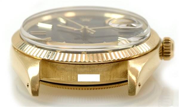 This image shows a side angle of a Rolex Date 1503 Men's Yellow Gold Black Dial 1503 Men's Yellow Gold Black Dial watch, revealing the case, bezel, crown, and a portion of the dial.
