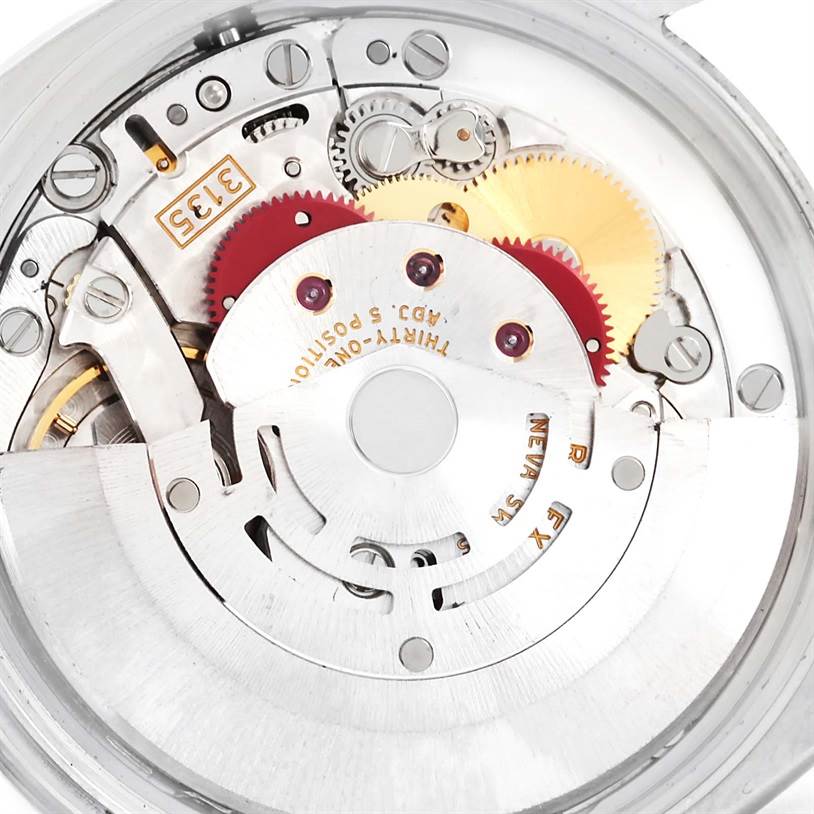 This image shows a detailed view of the Rolex Date 115210 Men's Stainless Steel White Dial 115210 Men's Stainless Steel White Dial model movement, revealing internal gears and components.