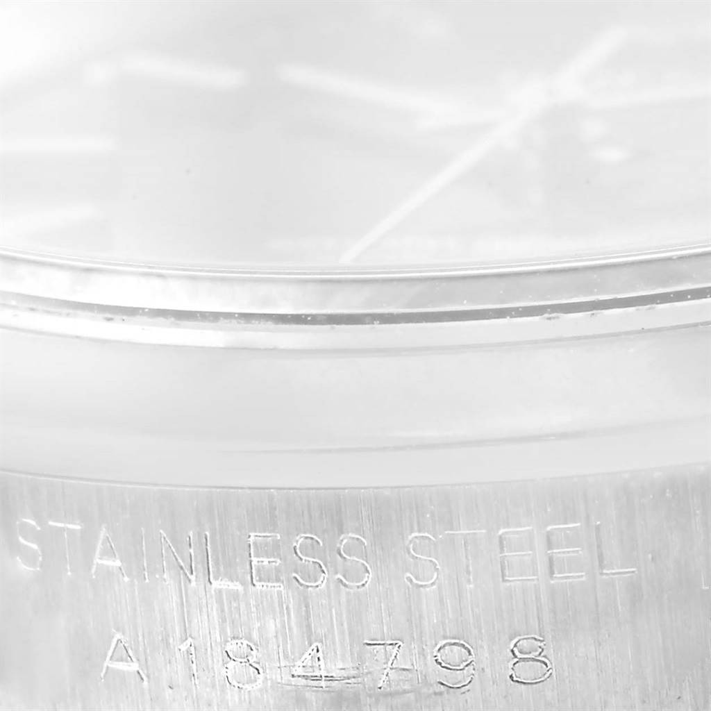 This image shows a close-up of the case and serial number engraving on a Rolex Date 15200 Men's Stainless Steel Black Dial 15200 Men's Stainless Steel Black Dial model watch.