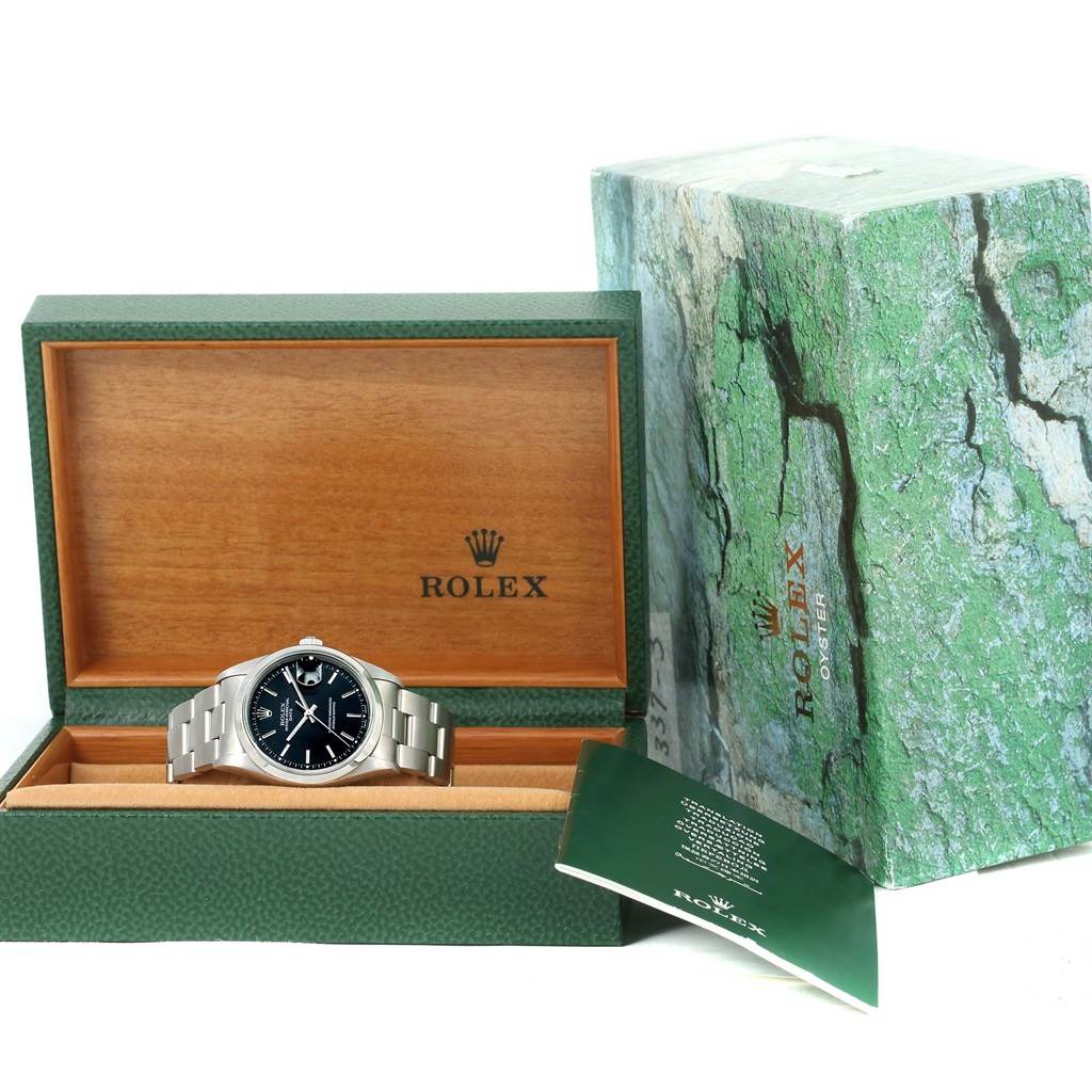 The image shows a Rolex Date 15200 Men's Stainless Steel Black Dial 15200 Men's Stainless Steel Black Dial model watch in its open green and wooden box, with the outer packaging and a manual visible.