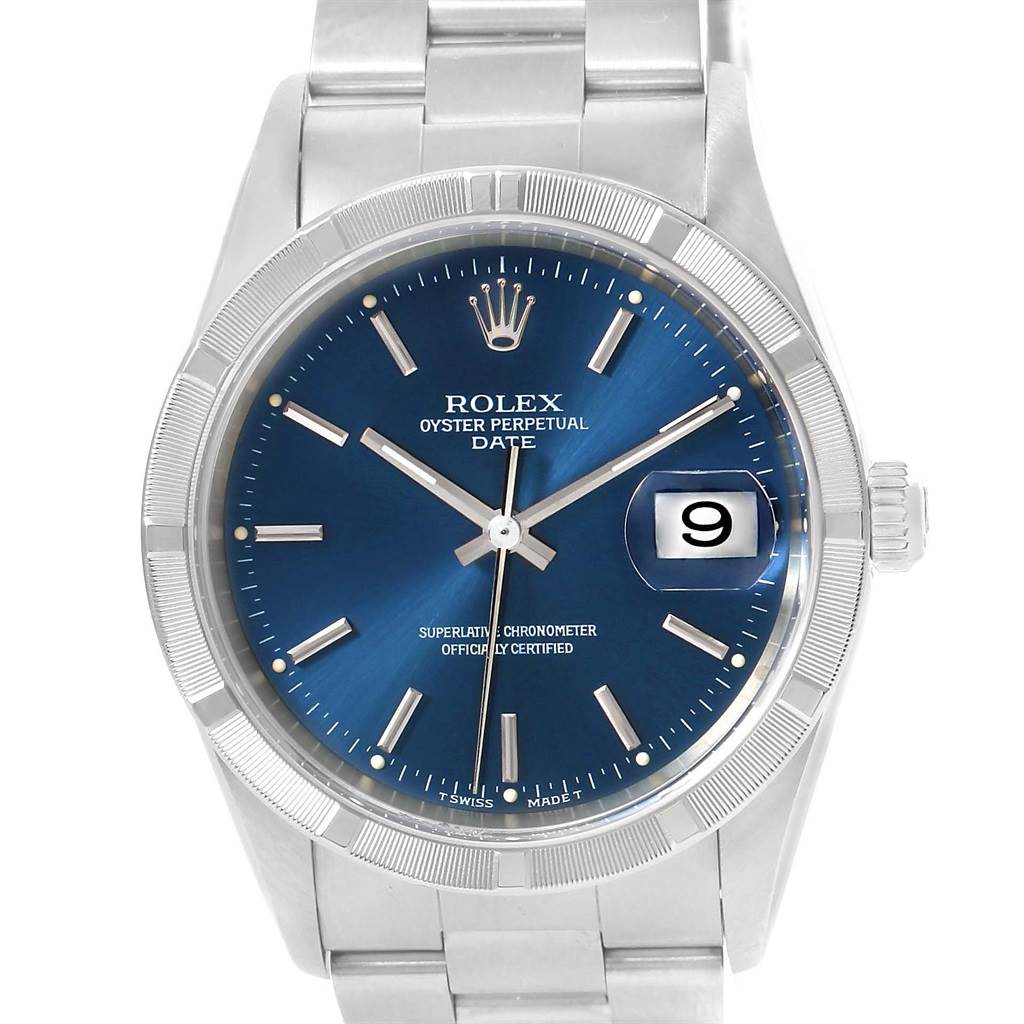 The image shows a Rolex Oyster Perpetual Date model watch, displaying its face, bezel, and bracelet at a front angle.