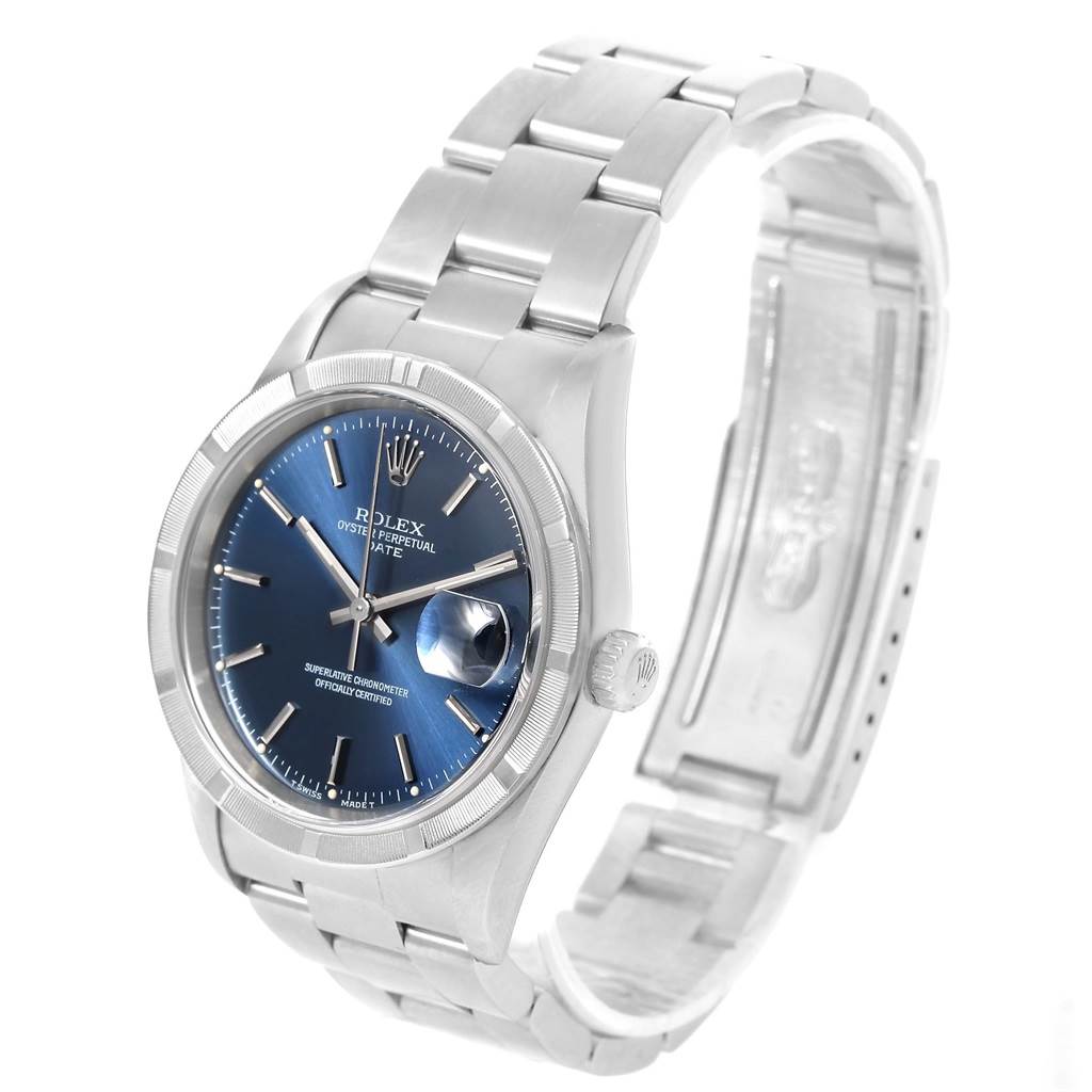 The image shows a Rolex Date 15210 Men's Stainless Steel Blue Dial 15210 Men's Stainless Steel Blue Dial watch featuring a blue dial and stainless steel bracelet, viewed from a front-left angle.