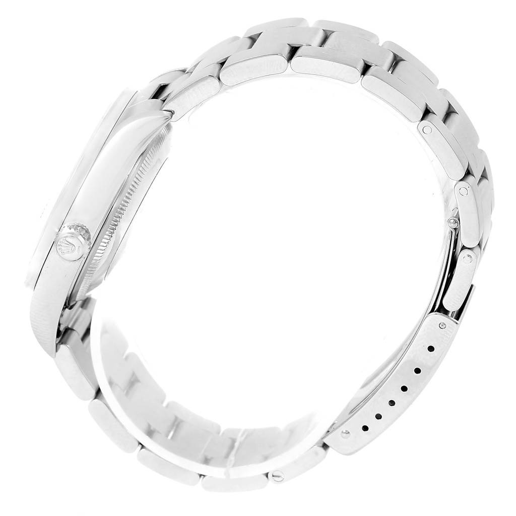 The image shows a side view of a Rolex Date 15210 Men's Stainless Steel Blue Dial 15210 Men's Stainless Steel Blue Dial model watch, highlighting its case, crown, and bracelet.