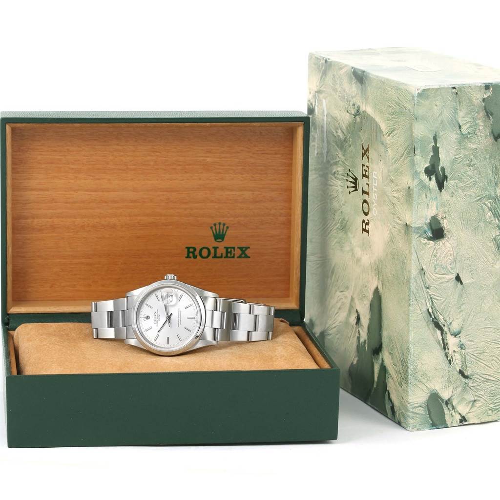 The image shows a Rolex Date 15200 Men's Stainless Steel Silver Dial 15200 Men's Stainless Steel Silver Dial model watch in its open box alongside the outer packaging, viewed from the front.