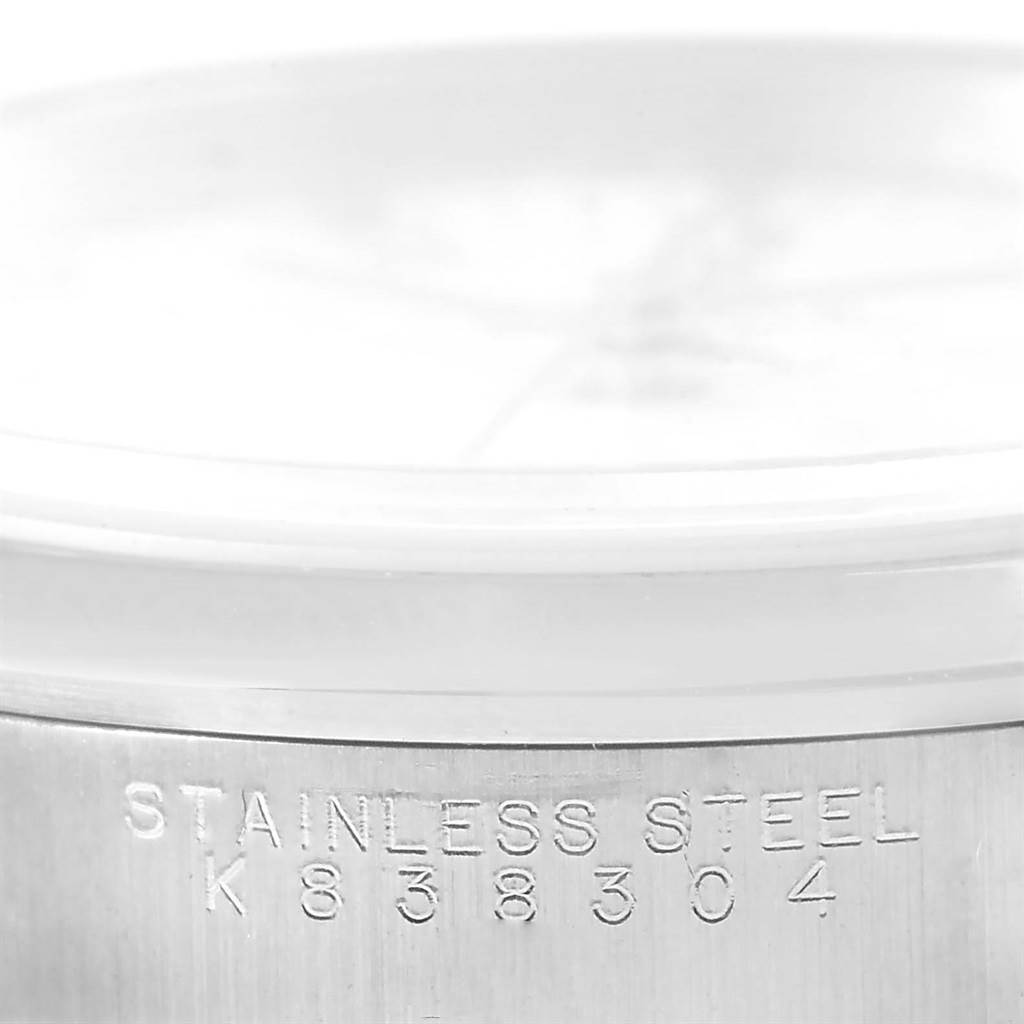 This image displays a close-up of the serial number engraving on the stainless steel case of a Rolex Date 15200 Men's Stainless Steel White Dial 15200 Men's Stainless Steel White Dial model watch.