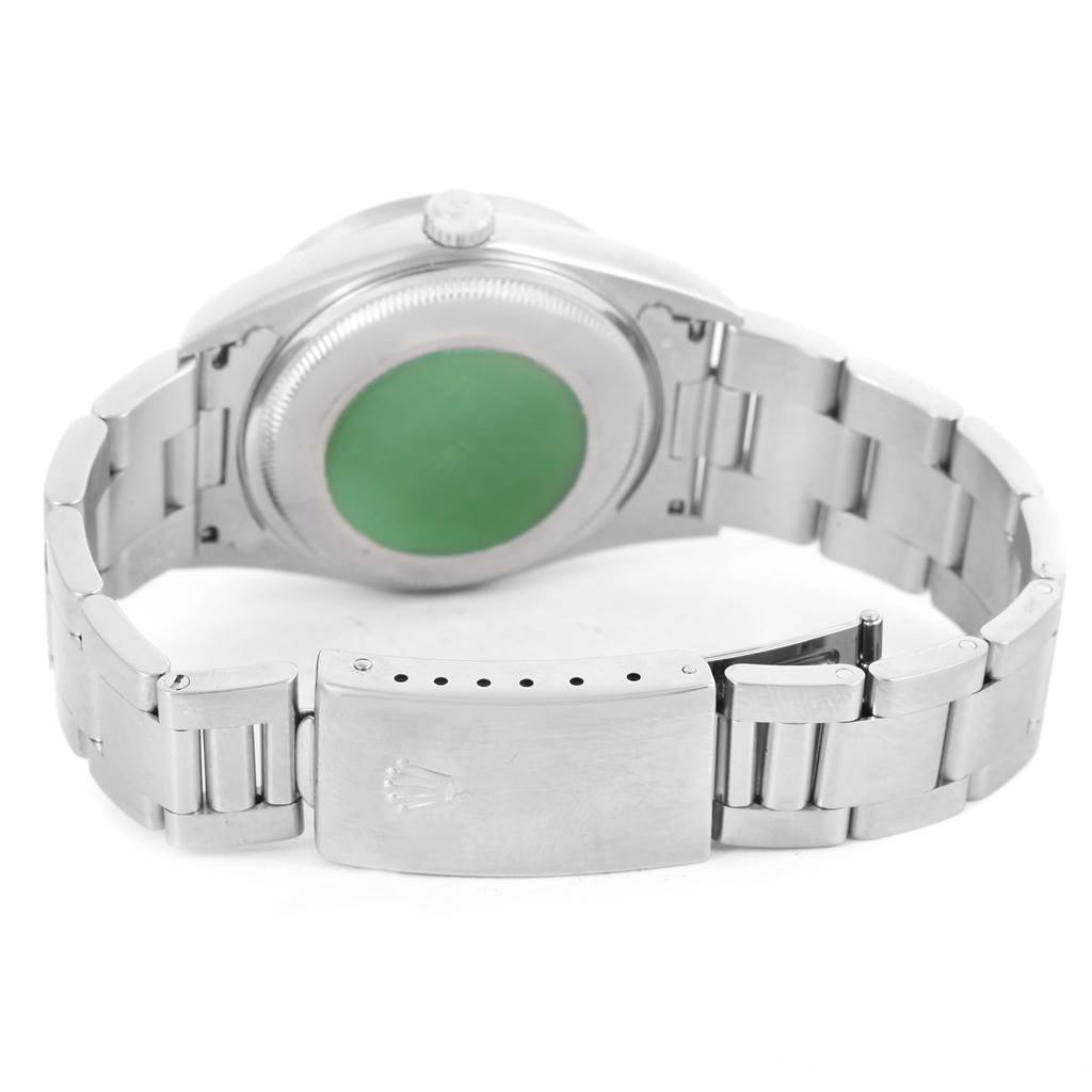 The image shows the back view of a Rolex Date 15210 Men's Stainless Steel Black Dial 15210 Men's Stainless Steel Black Dial watch, including the case back, crown, and bracelet with the clasp.